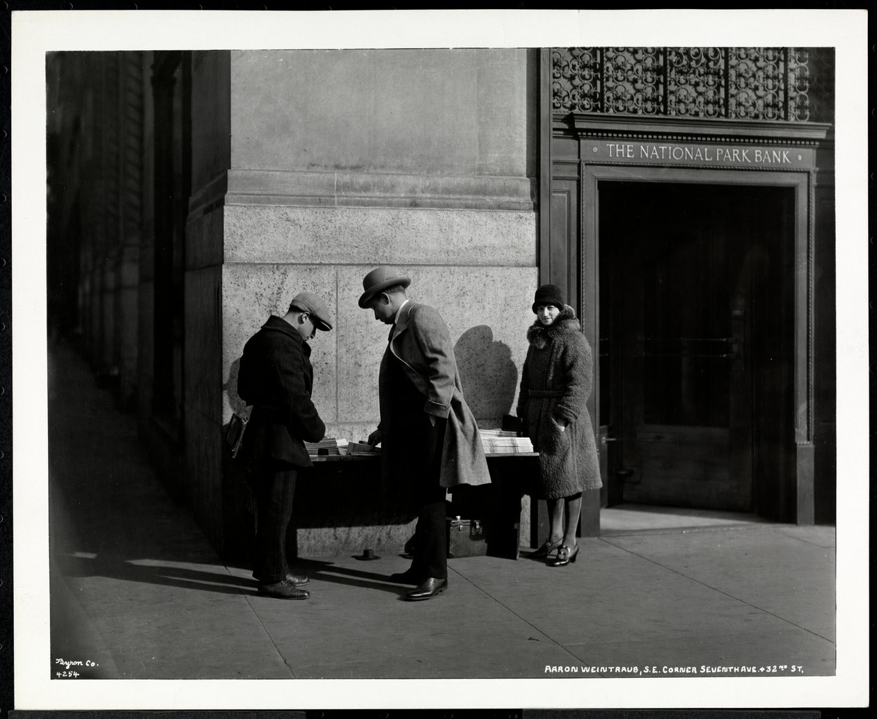 Blind news dealer, Aaron Weintraub, at his stand at the south east corner of 7th Avenue and 32nd Street, New York, 1930 (silver gelatin print) by Byron Company