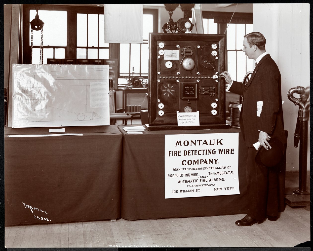Exhibit of a fire detection system by the Montauk Fire Detecting Wire Co. at the Museum of Safety Appliances of the American Institute of Social Service, New York, 1908 (silver gelatin print) by Byron Company