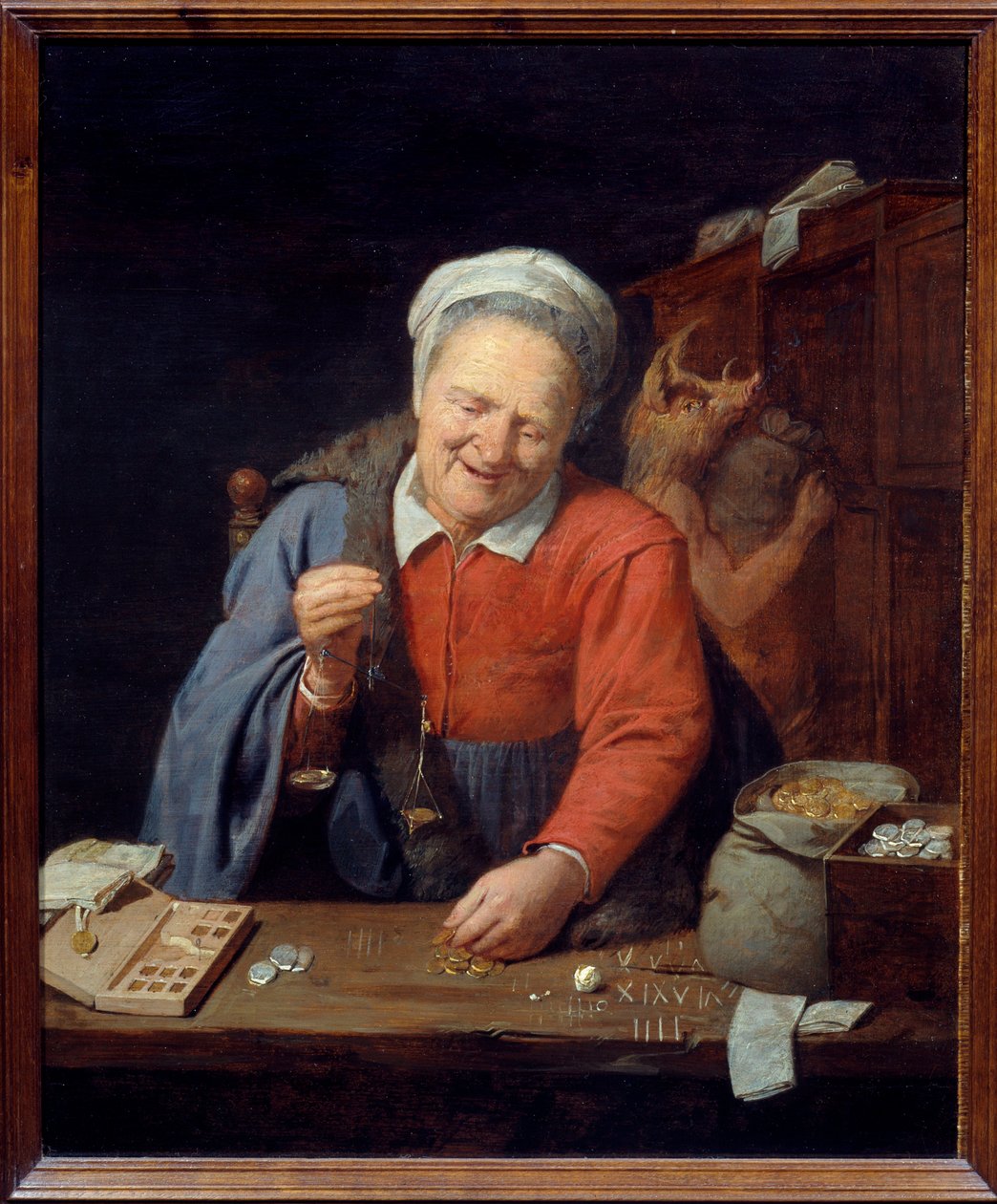 Altın tartı. Küçük ölçekli yaşlı bir kadın altınları tartarken, altta domuz başlı bir adam çantaları dolaba yerleştiriyor. David III Ryckaert (1612-1661) Ec. Alev. by David III Ryckaert