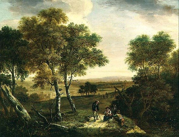 Bir patika boyunca köylülerle dolu geniş bir ormanlık manzara, ötesinde bir kasaba by Dionys Verburgh