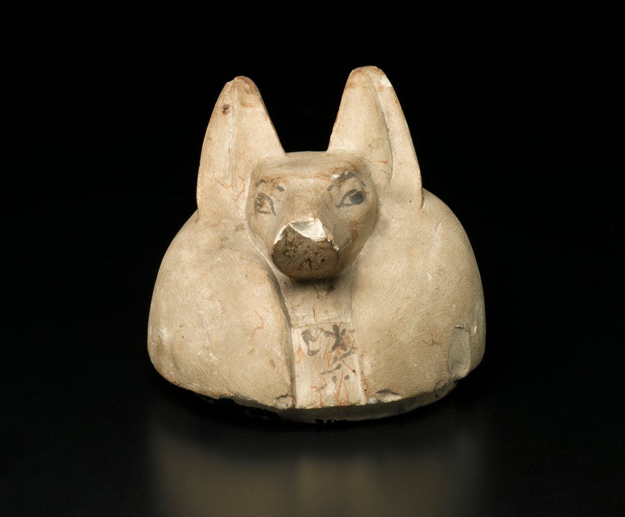 Kanopik bir kavanozun çakal başlı kapağı (kireçtaşı) by Egyptian