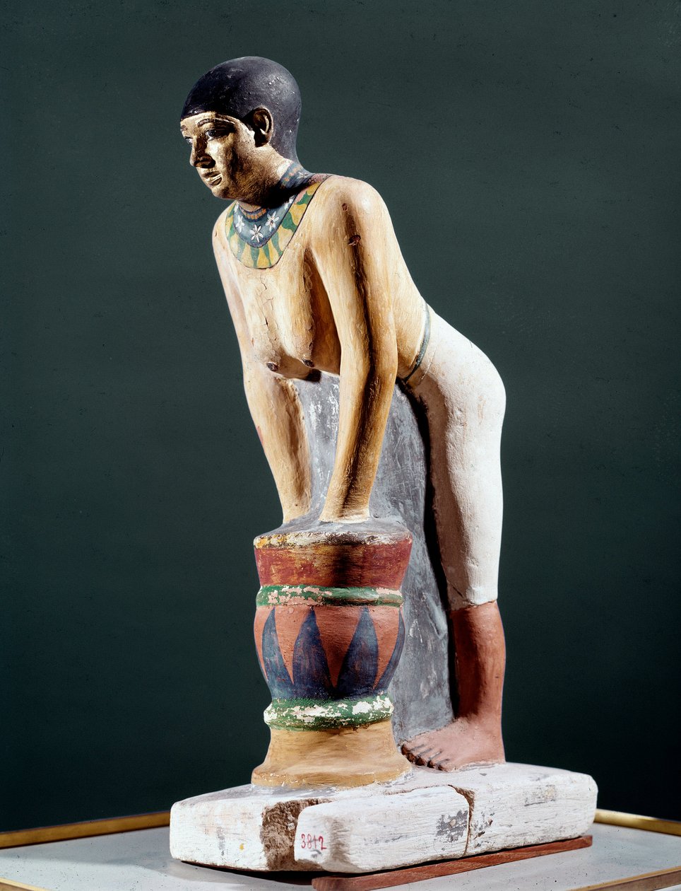 Egyptian antiquite: “” Egyptian working barley to make beer”” Figurine. 5th dynasty. 2400 BC. Florence, Museo Archeologico - Egyptian antiquities: Egyptian woman filtering barley bread to make beer. Figurine. 5th dynasty. 2400 BC. National Archaeological M by Egyptian 5th Dynasty