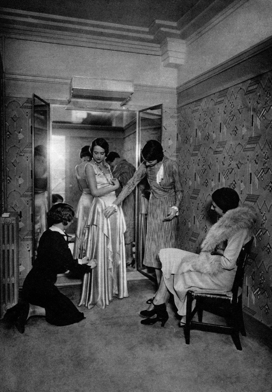 Harika bir terzide elbise denerken, Paris, 1931. by Ernest Flammarion