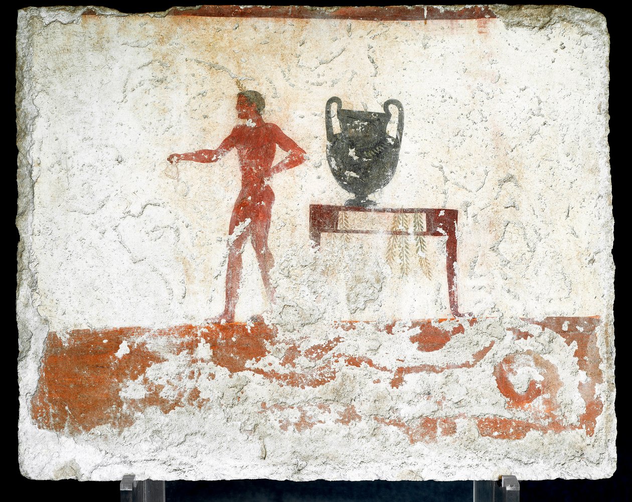 Etrüsk sanatı: bir vazonun yerleştirildiği bir masanın yanında genç bir çıplak ephebe. "Dalgıcın" mezarının freski. Paestum