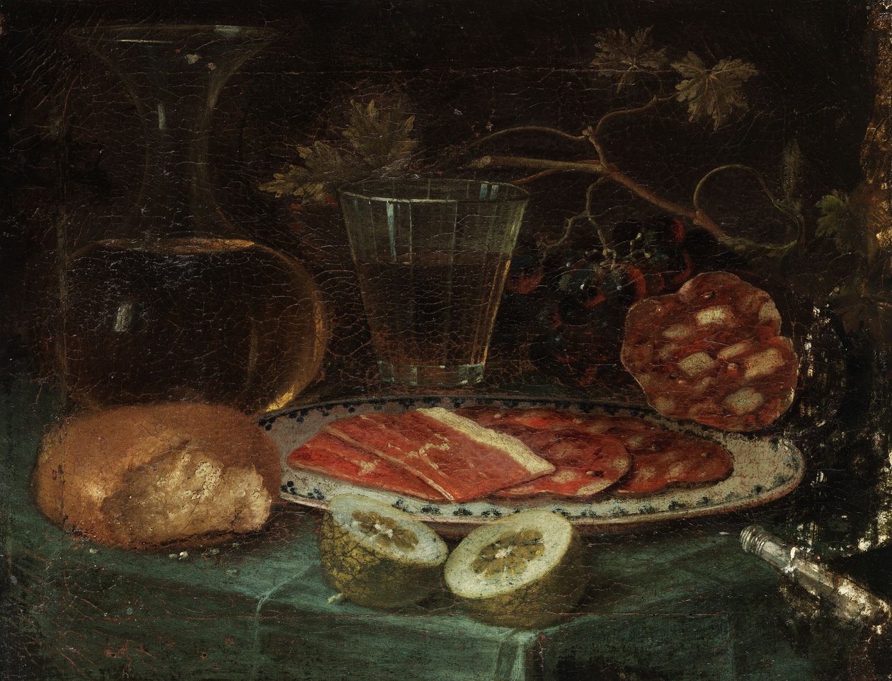 Bir parça ekmek, bir cam sürahi, bir şarap bardağı, jambon ve jambonlu bir tabak, bir limon ve sedef saplı bir bıçak ile natürmort by Italo flämischer Maler des 17. Jahrhunderts