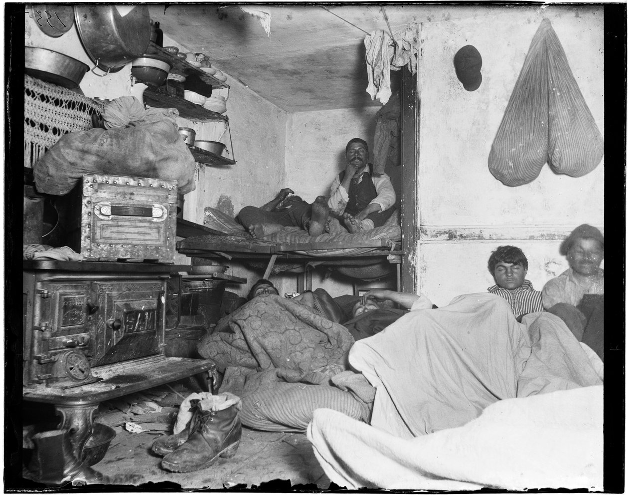 Lodgers in a crowded Bayard Street tenement - Five cents a spot.  by Jacob August Riis