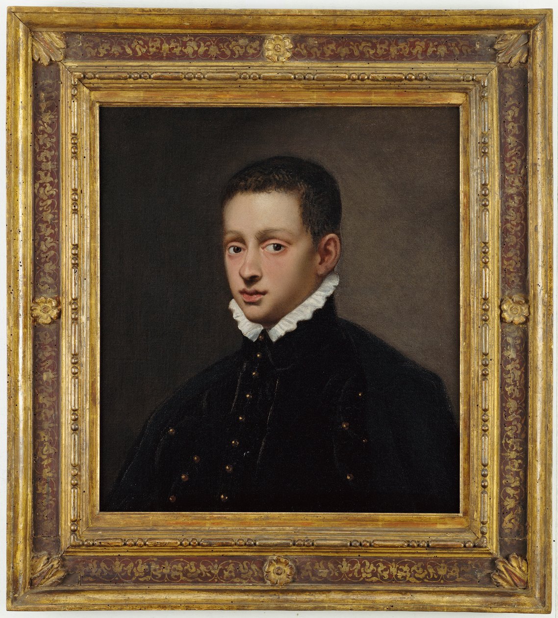 Beyaz yakalı siyah bir yelek giymiş, göğüs boyunda bir çocuğun portresi. by Jacopo Robusti Tintoretto