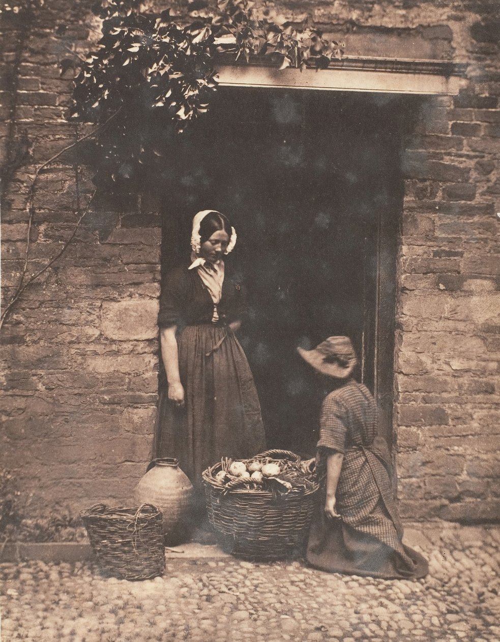 [İki Kadın, Biri Diz çökmüş, biri Ayakta, Sebze Dolu Sepete Bakıyor], 1853-56. by John Dillwyn Llewelyn