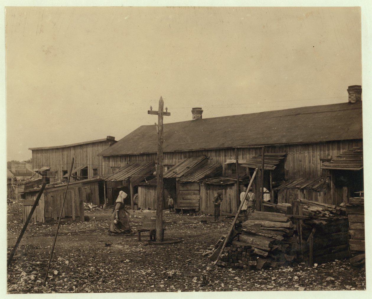 Housing for about 50 employees of Maggioni Canning Co., Port Royal, South Carolina, surrounded by marsh and on an old shell pile, 1912  by Lewis Wickes Hine