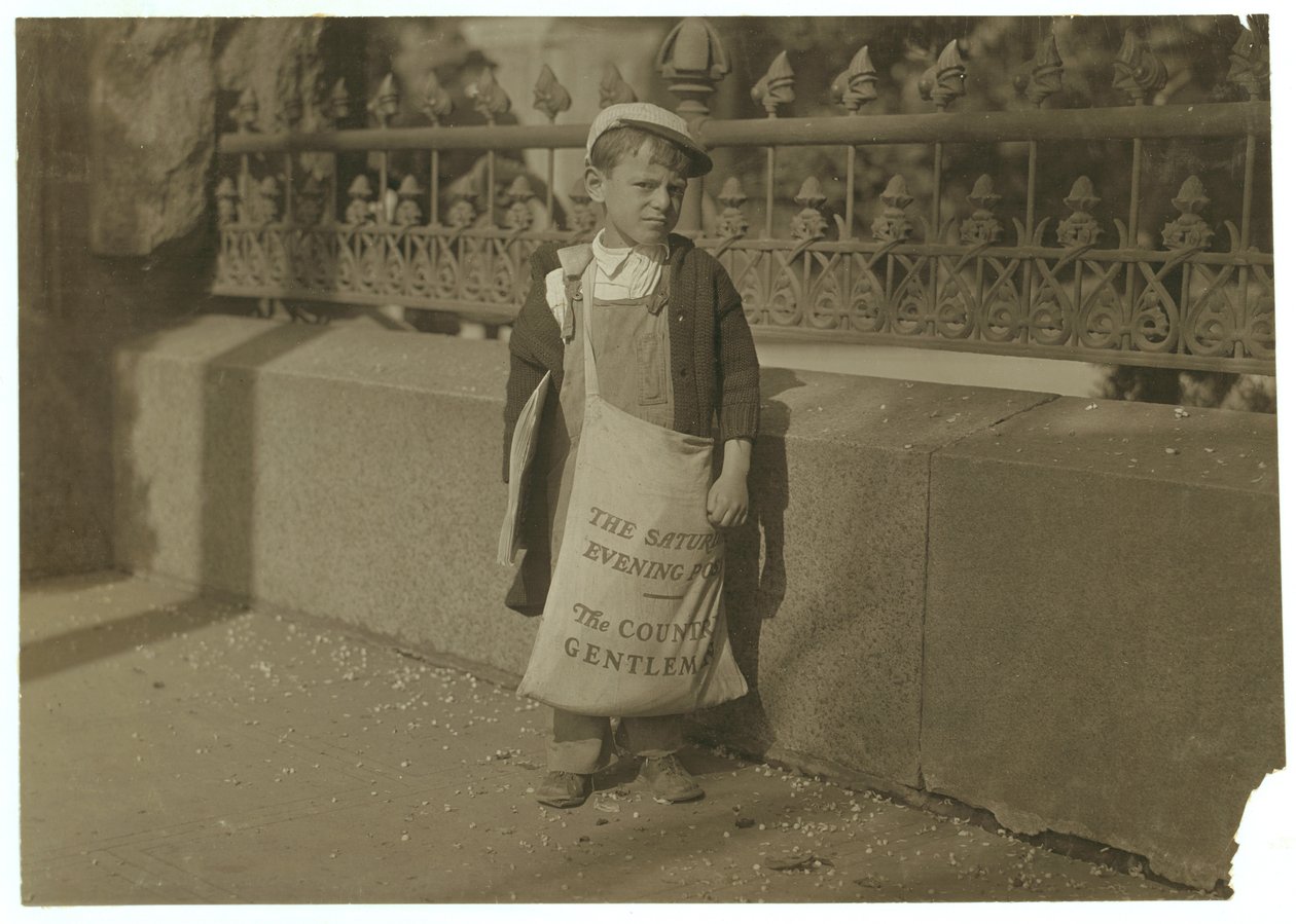 Newsboy Freddie Kafer, 5 or 6 years old, selling Saturday Evening Posts at the entrance to the State Capitol, Sacramento, California, 1915  by Lewis Wickes Hine