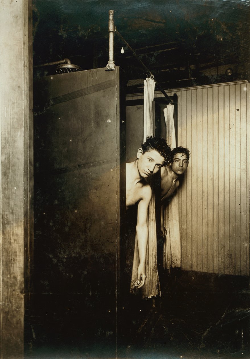 Telegraph boys using shower baths, Postal Tel. Co., Broadway, New York, 1910  by Lewis Wickes Hine