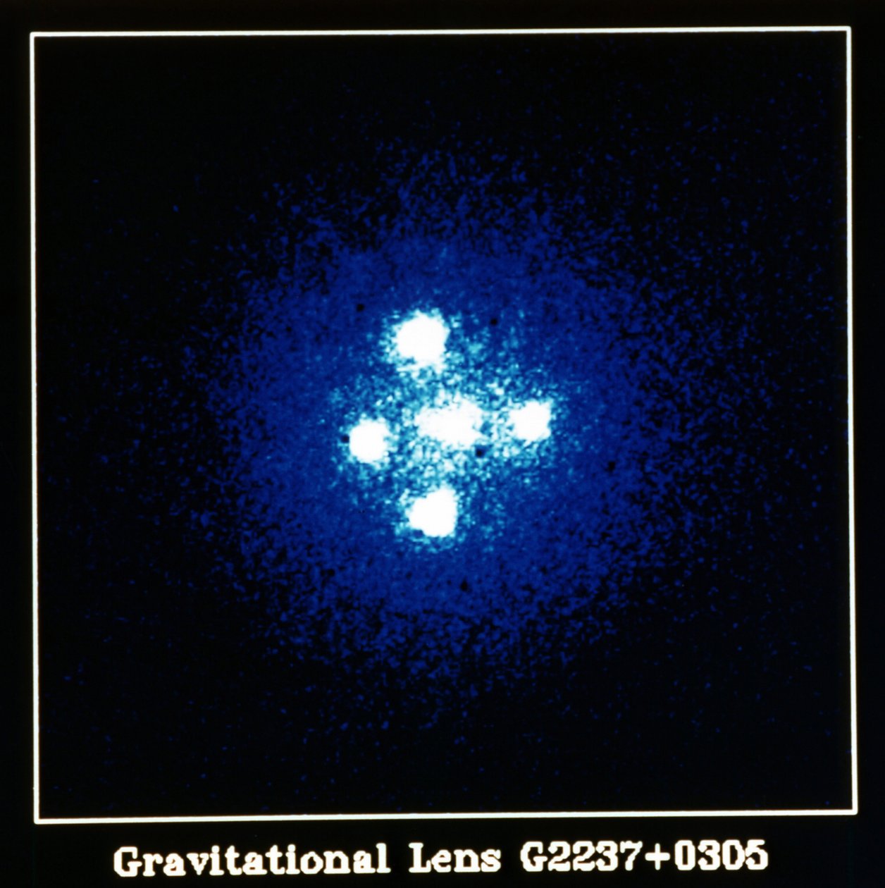 Einstein Cross Quasar: Yerçekimi Merceği G2237 artı 0305. NASA fotoğrafı. by National Aeronautics and Space Administration National Aeronautics and Space Administration