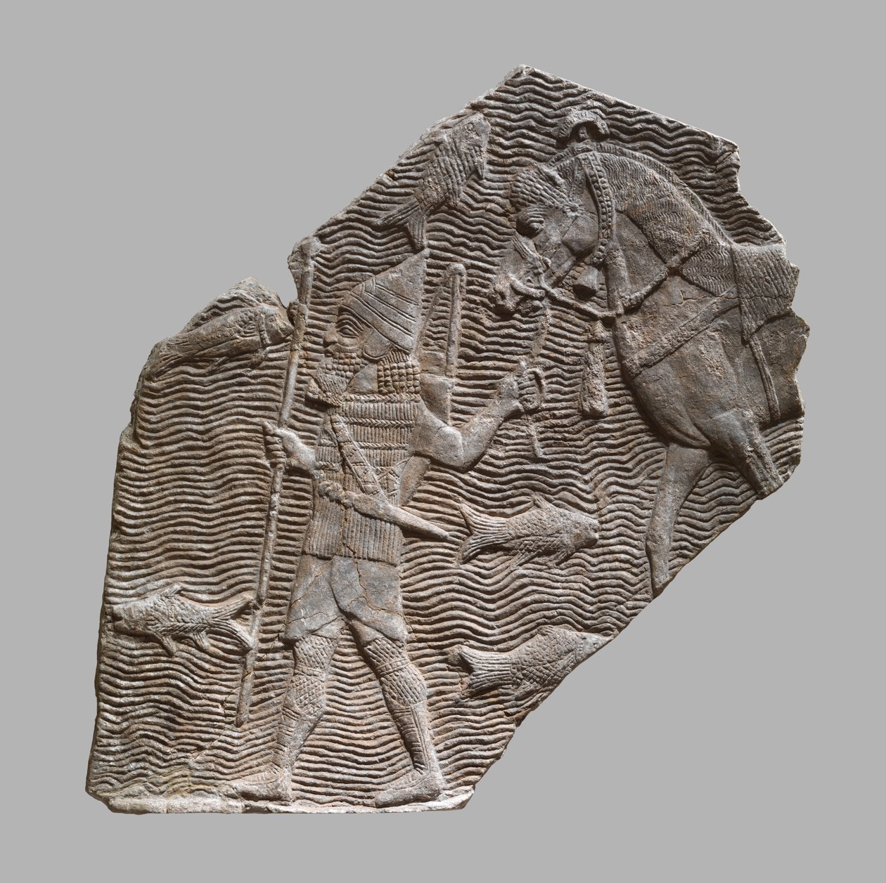Rölyef parçası: atını bir dere kenarında götüren süvari, MÖ 704–681 dolayları. (alçıtaşı kaymaktaşı) by Neo Assyrian