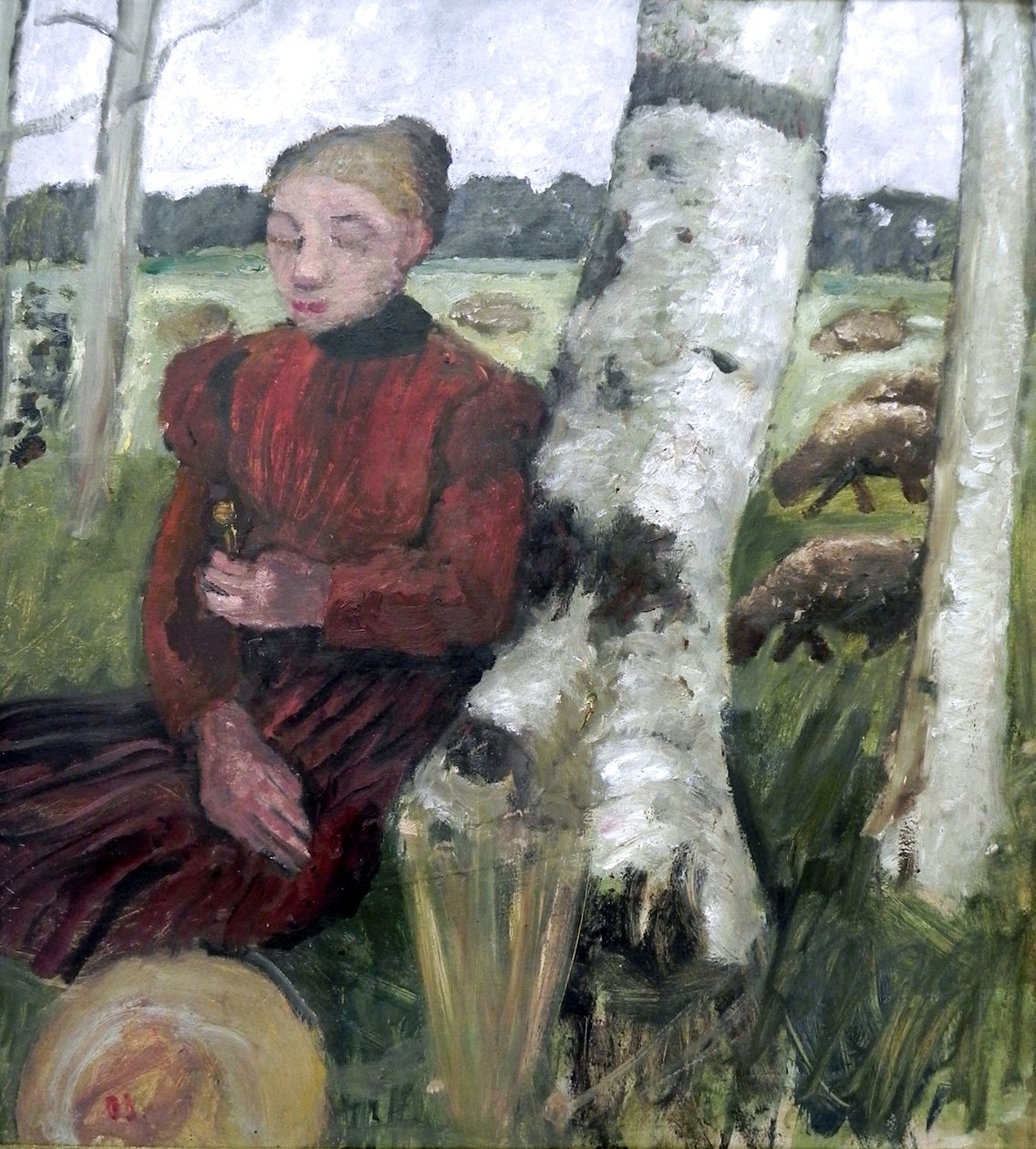 Huş ağacı gövdesinde oturan kız, arka planda koyun sürüsü. by Paula Modersohn Becker