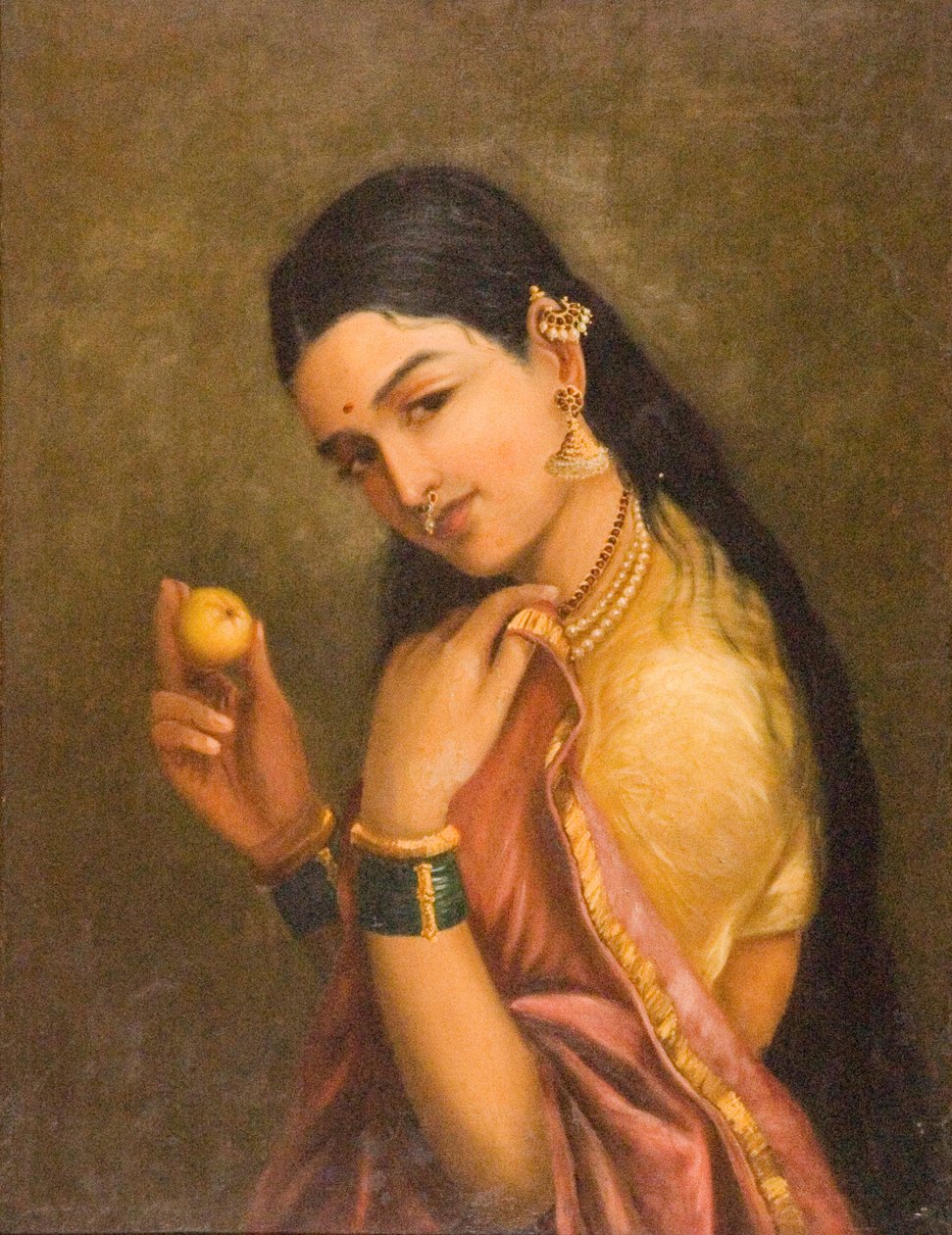 bir meyve tutan kadın by Raja Ravi Varma