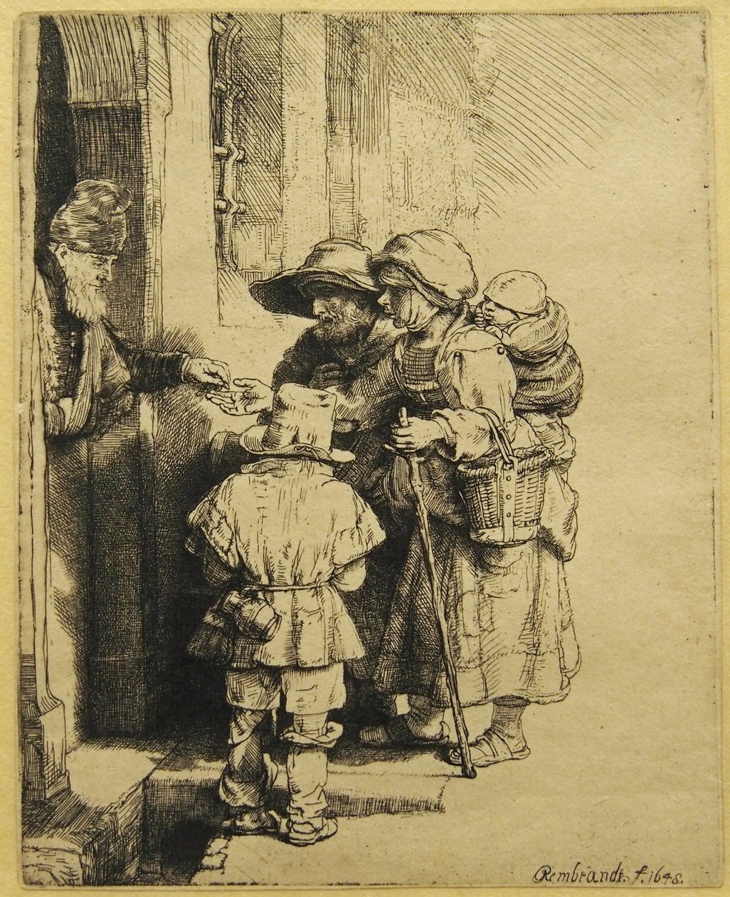 Kör bir Hurdy-gurdy Oyuncu ve Ailesi Sadaka Alan by Rembrandt van Rijn