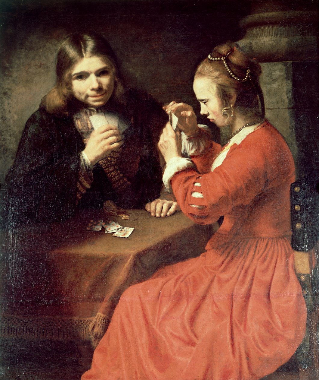Genç bir adam ve iskambil oynayan bir kız by Rembrandt van Rijn