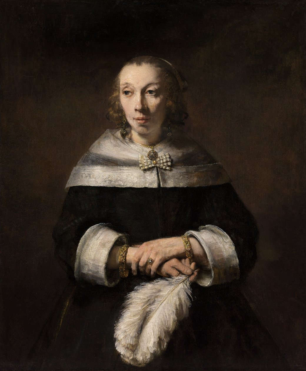 Devekuşu Tüylü Yelpazeli Bir Kadının Portresi by Rembrandt van Rijn