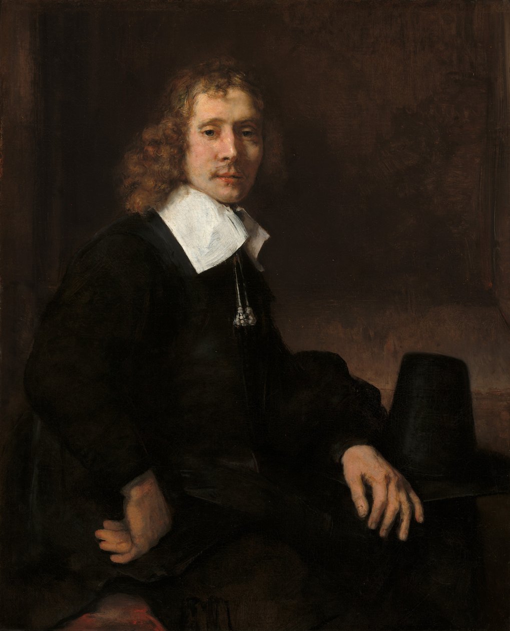 Bir Masada Oturan Genç Bir Adam (muhtemelen Govaert Flinck) by Rembrandt van Rijn