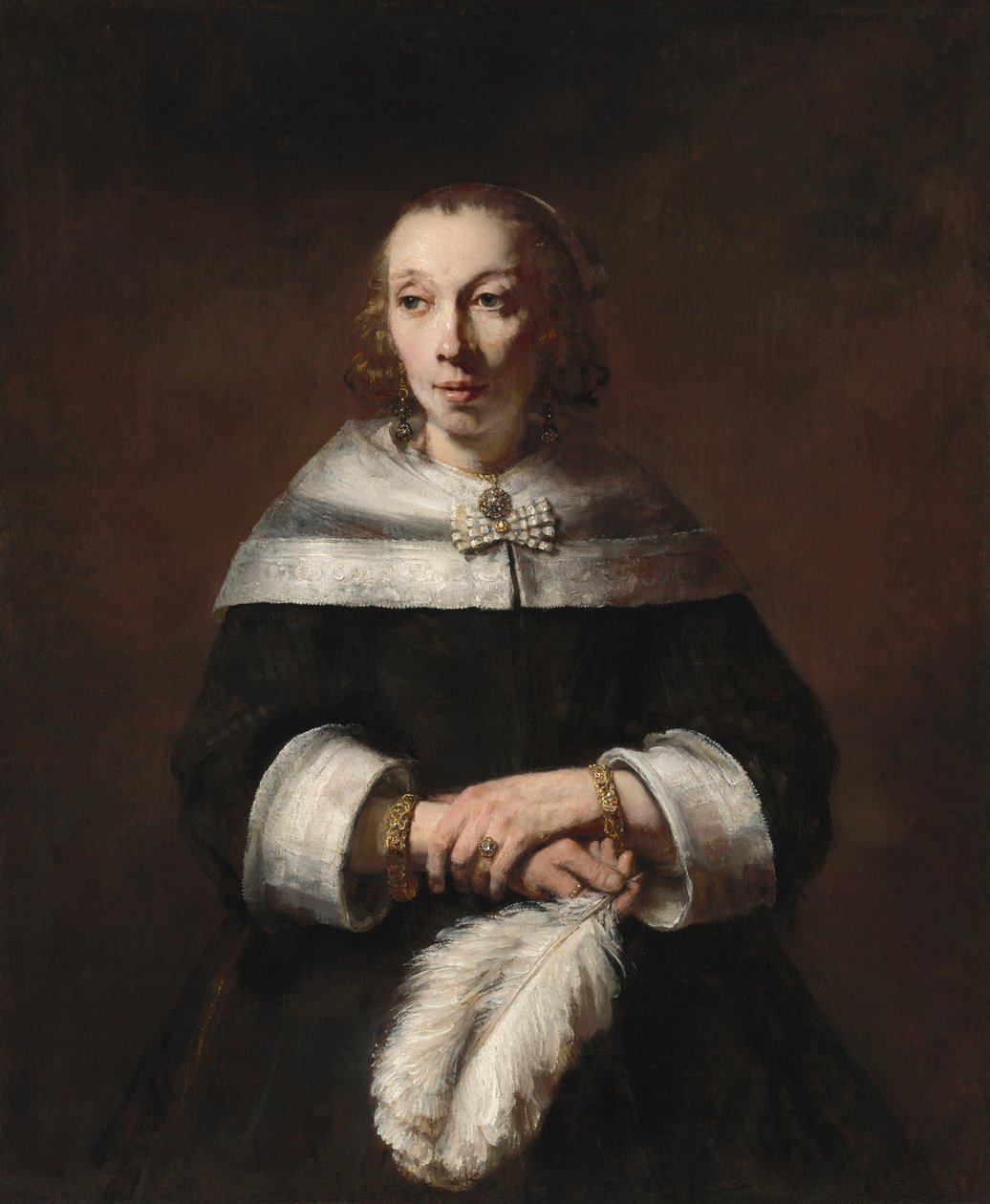 Devekuşu Tüylü Yelpazeli Bir Kadının Portresi by Rembrandt van Rijn