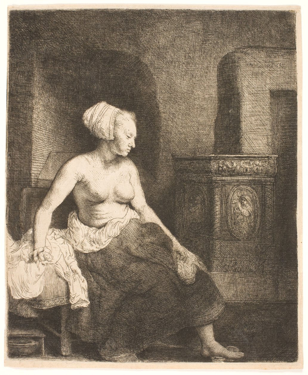 Bir sobanın yanında yarı giyinik oturan kadın by Rembrandt van Rijn