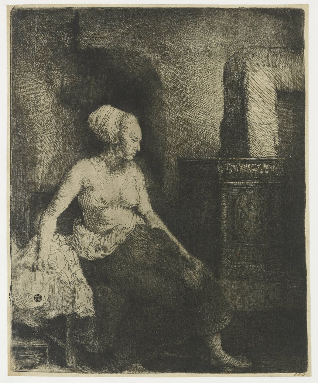 Bir sobanın yanında yarı giyinik oturan kadın by Rembrandt van Rijn