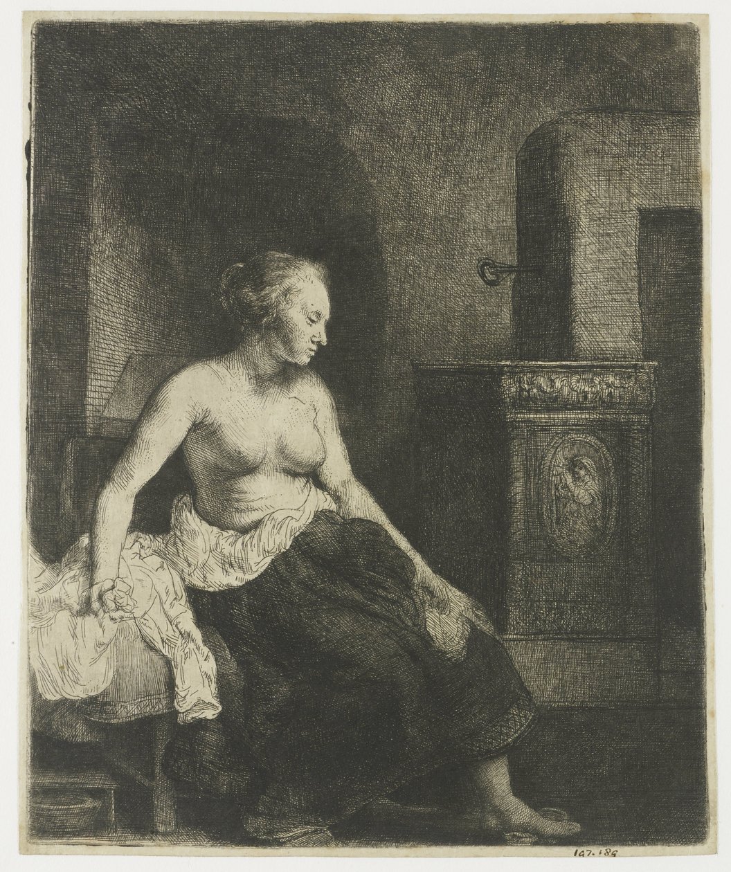 Bir sobanın yanında yarı giyinik oturan kadın by Rembrandt van Rijn