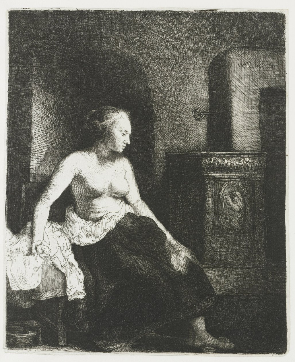 Bir sobanın yanında yarı giyinik oturan kadın by Rembrandt van Rijn
