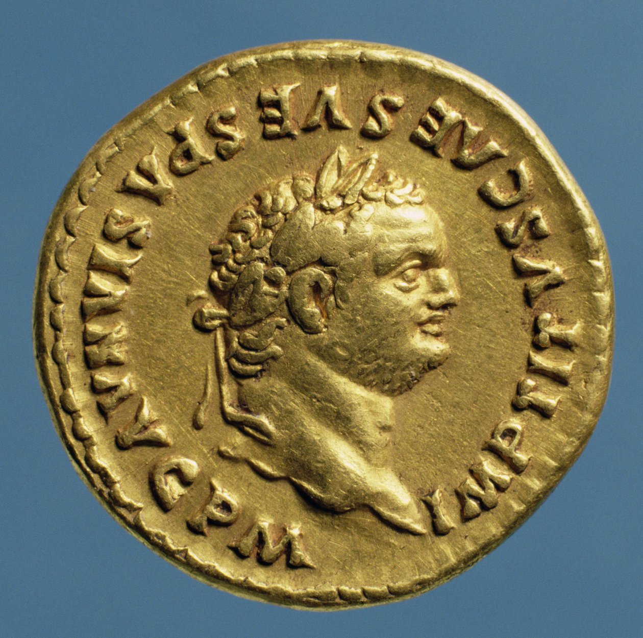 Aureus (obverse) of Titus (AD 79-AD 81) wearing a laurel wreath. (gold) Inscription: IMP TITVS CAES VESPASIAN AVG P M by Roman