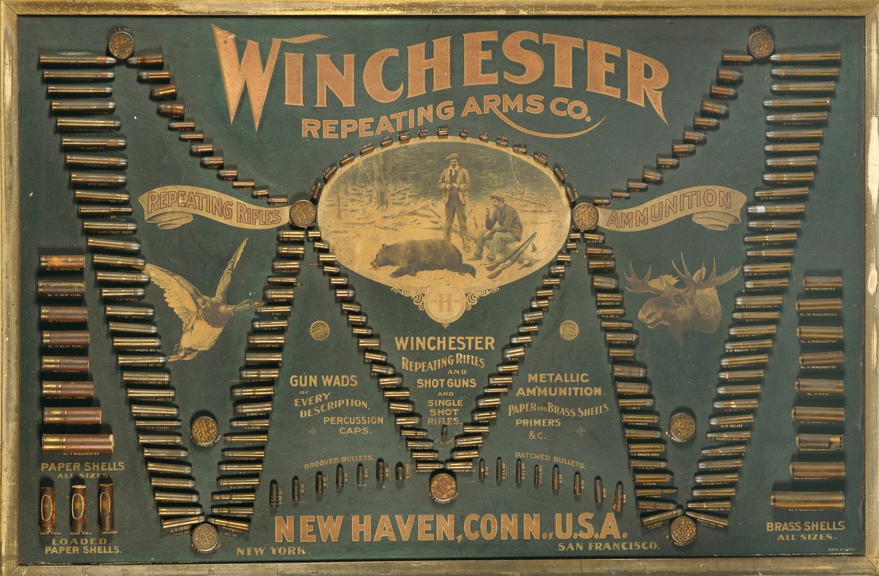 Genişletilmiş bir "W" şeklinde düzenlenmiş kapsamlı bir metalik, pirinç ve kağıt kasalı tüfek ve atış kartuşu seçimine sahip bir Winchester Cartridge ekran kartı by Unbekannt