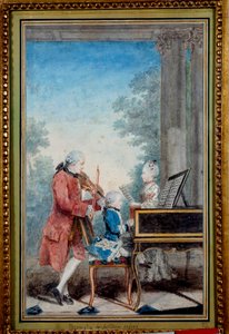 Wolfgang Amadeus Mozart (1756-1791) babası ve kız kardeşiyle piyano çalan bir çocukken