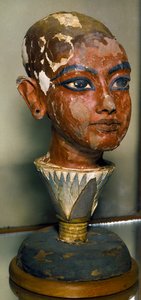 Egyptian antiquitis: portrait of the young pharaoh Tutankhamun (all-Ankh-amun or Tutankhamun) supported by a lotus leaf. Painted wood carving. From the Tresor of Tutankhamun. Egyptian Museum, Cairo. by Egyptian 18th Dynasty