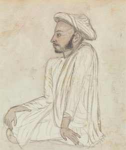 Bağdaş kurmuş oturan adam