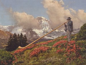 İsviçre: Bir Alphorn Blower, arka planda Jungfrau (renkli fotoğraf)