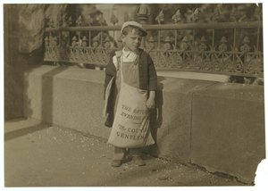 Newsboy Freddie Kafer, 5 or 6 years old, selling Saturday Evening Posts at the entrance to the State Capitol, Sacramento, California, 1915  by Lewis Wickes Hine