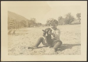[Sahilde Çocuk ve Köpek] by Louis Fleckenstein