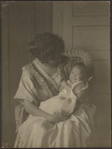 [Florence Sallanan Sandalyede Bebek Tutuyor] by Louis Fleckenstein