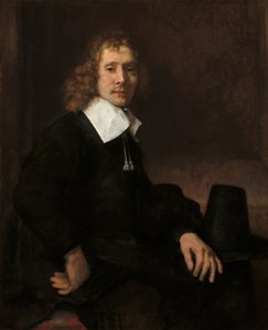 Bir Masada Oturan Genç Bir Adam muhtemelen Govaert Flinck, c. 1660. by Rembrandt van Rijn