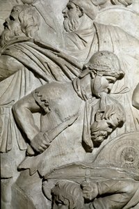 Roma sanatı: “” Dişlerinin arasında bir düşman savaşçının başını tutan Romalı savaşçı”” İmparator Trajan döneminde Roma