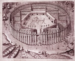Hint kulübelerinin savunma sistemi, etrafına dikilmiş çift sıra ağaç gövdeleriyle. Kesilen düşman kafaları en üste yerleştirilir (Gravür by Theodore de Bry
