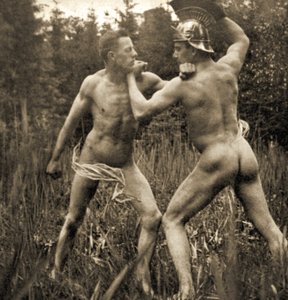 Fightingbattle pose with a Roman Helmet, c.1910 (sepia photo) by Unknown