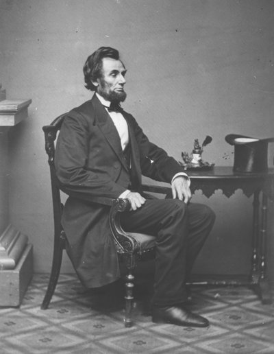 Abraham Lincoln, tam boy portre, oturmuş, 1861 by Alexander Gardner