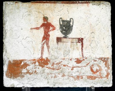 Etrüsk sanatı: bir vazonun yerleştirildiği bir masanın yanında genç bir çıplak ephebe. "Dalgıcın" mezarının freski. Paestum