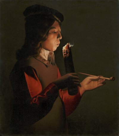 La Tour, Georges, de (1583-1652) tarafından, pipolu genç bir çocuk, bir ateş parçasına üfler. tuval üzerine yağlıboya by Georges de La Tour