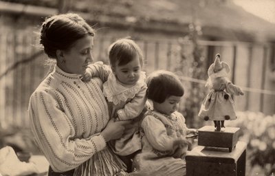 Woman with babies and doll by Phillipe de Marlier
