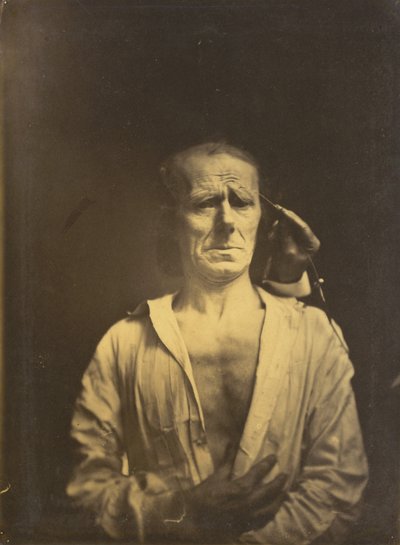 m spazmı çok güçlü ışık altında oluklu supercilii (solda); Rahatlamış bir yüz (tam güneş ışığında fotoğraflandı) (sağda) by Guillaume Benjamin Amant Duchenne
