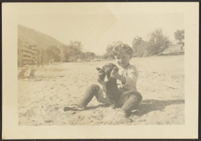 [Sahilde Çocuk ve Köpek] by Louis Fleckenstein