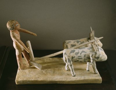 İki öküz tarafından çizilmiş sabanına öncülük eden bir pullukçunun cenaze modeli (boyalı ahşap) by Middle Kingdom Egyptian
