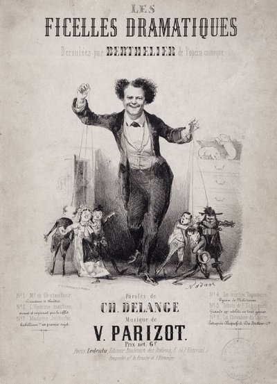 Kuklaların oğullarını tutan Jean Berthelier