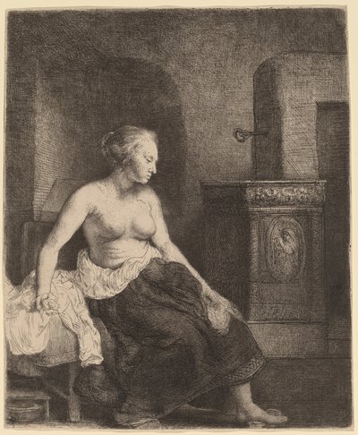 Bir sobanın yanında yarı giyinik oturan kadın by Rembrandt van Rijn